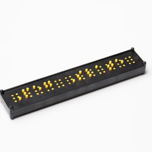 The black and yellow Peg Slate placed on a white background