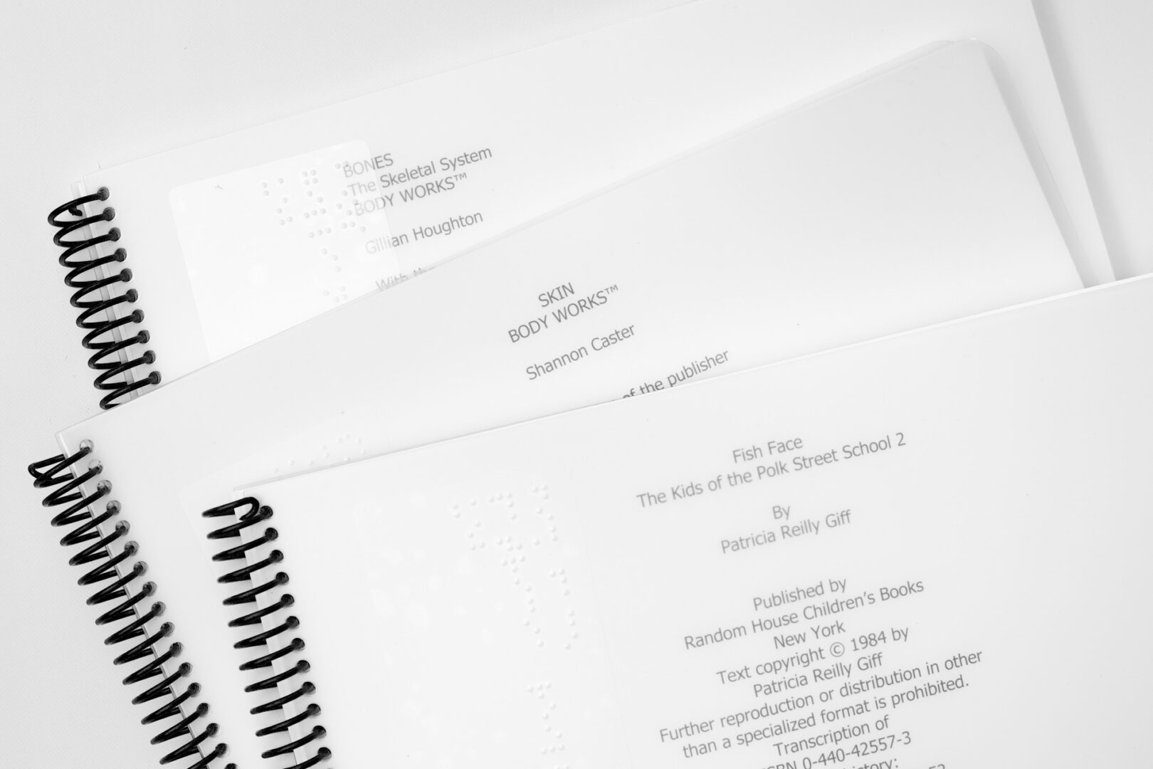 The Unit 7 celebration books in a stack