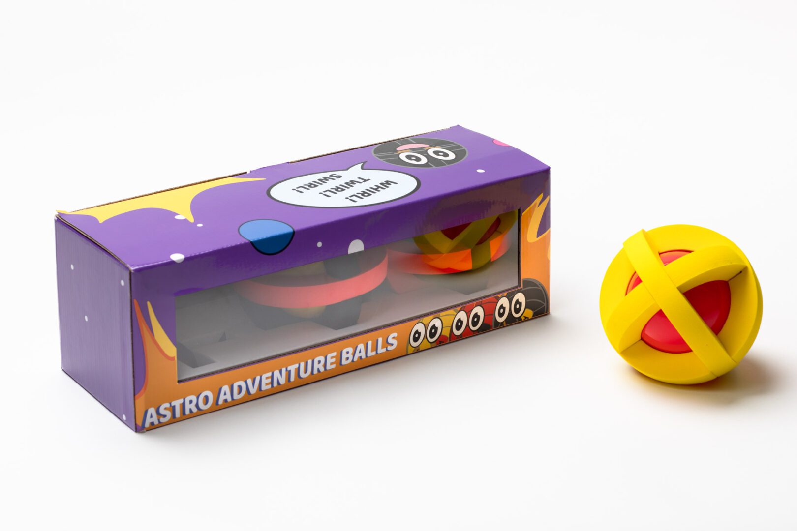 The purple and yellow decorative Astro Adventure Balls box with a yellow ball placed next to it.