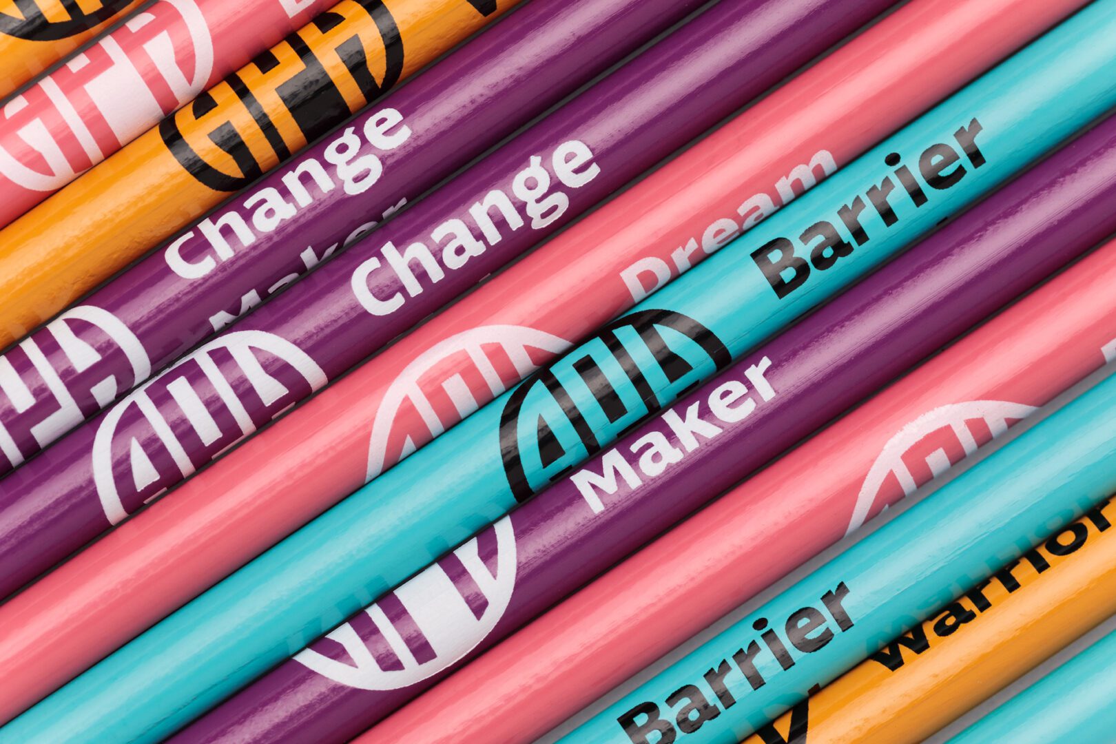 Bold Pencils 4Z9A3862-web A close up photo of multicolored bold line pencils with the APH logo and brand personas.