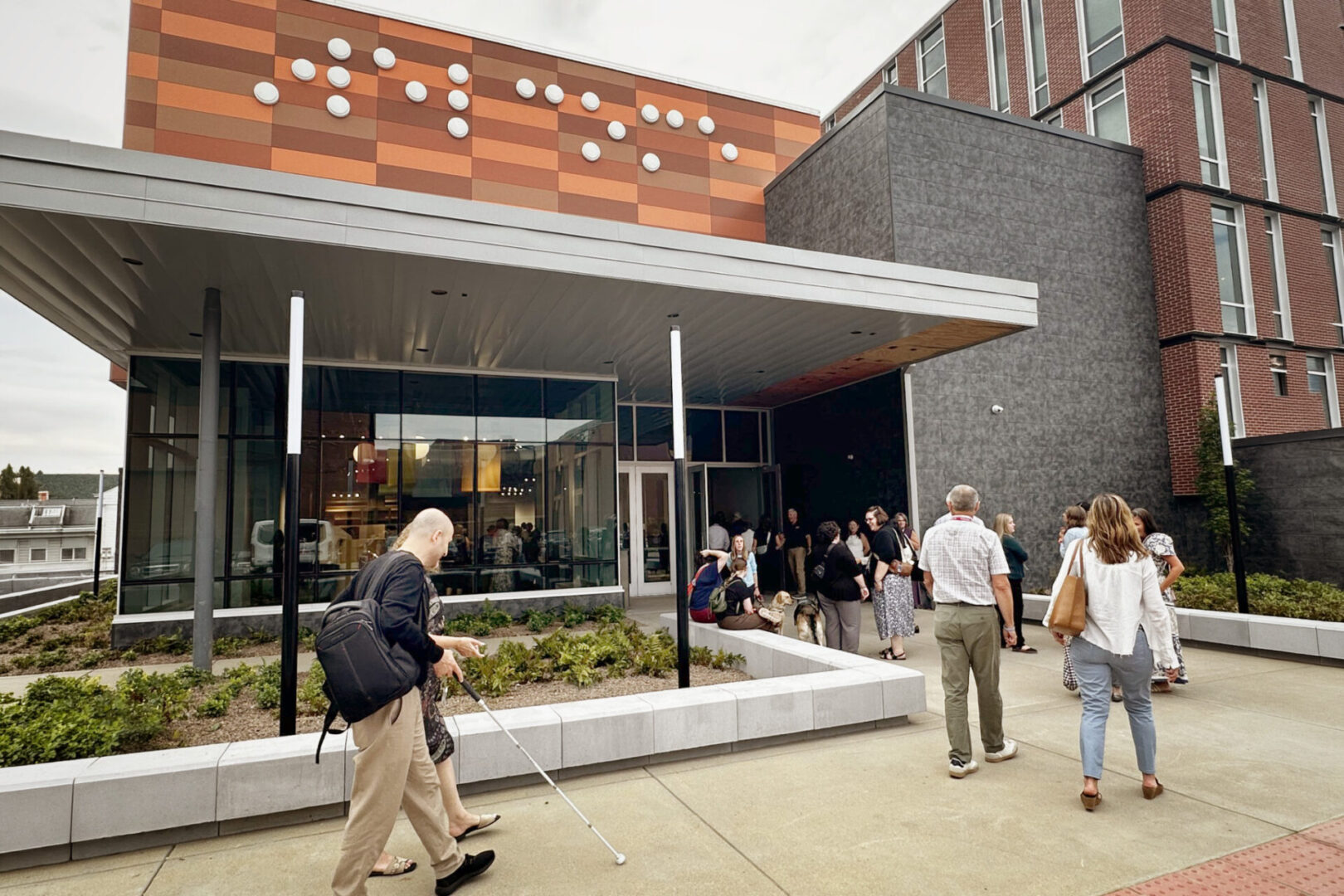 Groups of people walking into The Dot Experience at American Printing House
